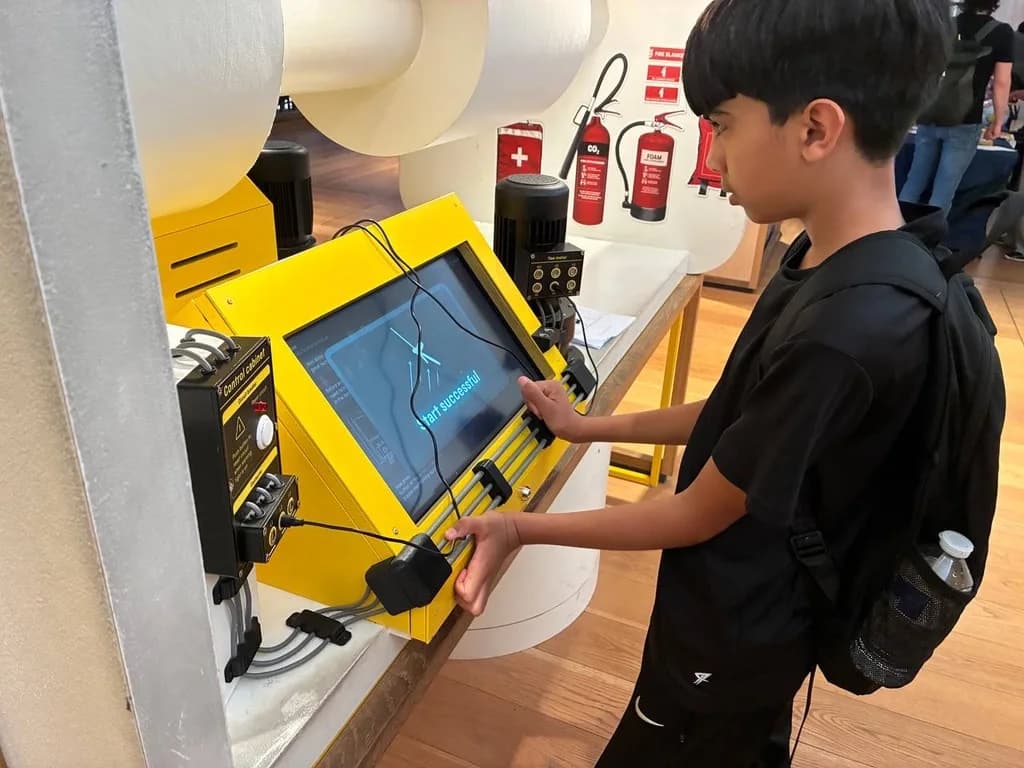 A student operating equipment during a technology session
