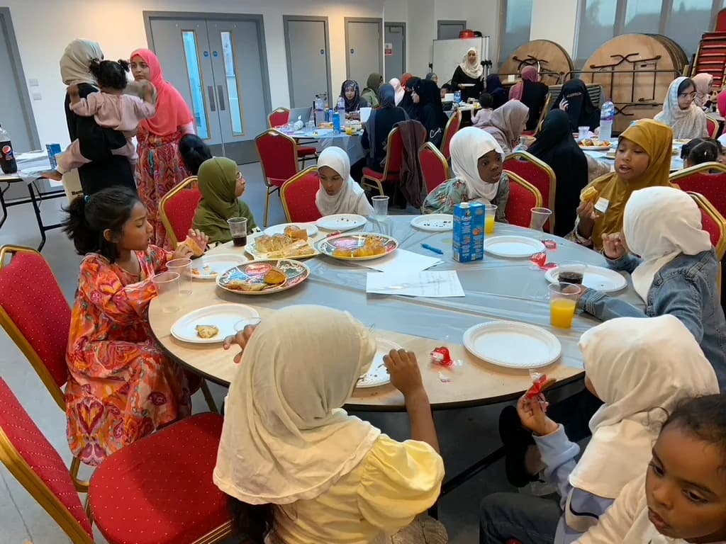Families sharing a meal at a school community event