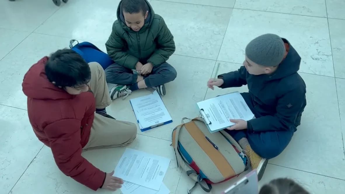 Children reading together at a Forerunners book club session